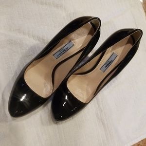 Prada Black Leather Pumps. With signature bag